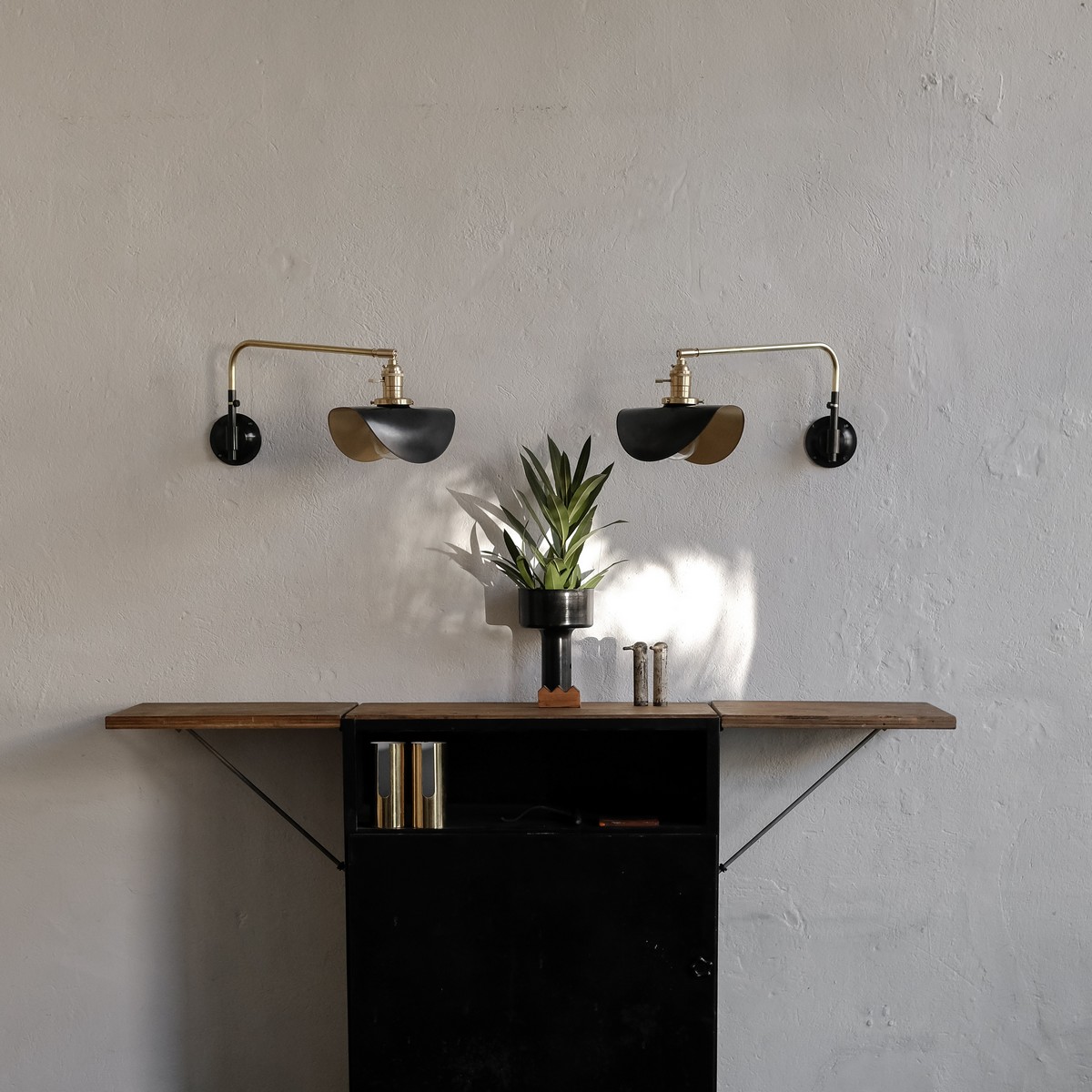 Pair of small brass swing wall lamp